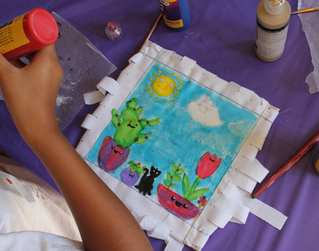 Child making a no-sew pillow